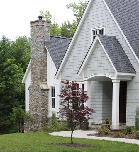 beige house with gray metal roofing|beige and gray exterior ideas.